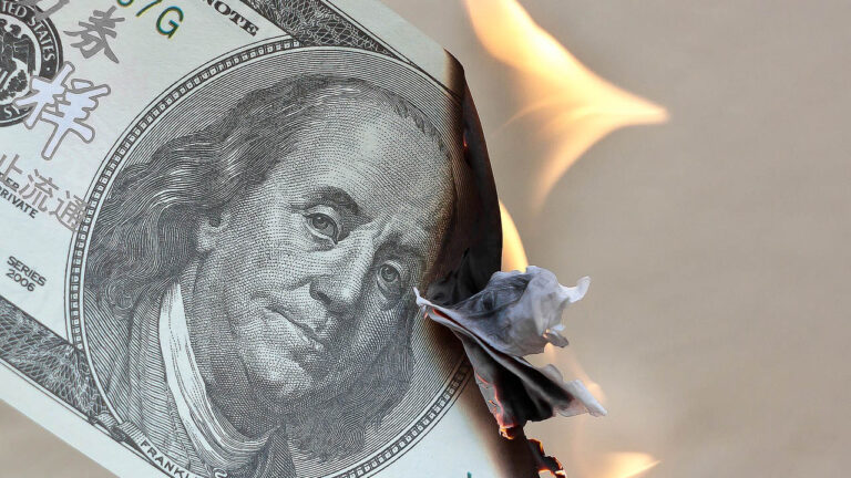 Dollar bill burning.